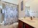 Bathroom featuring vanity, framed mirror, shower and tub combo, and decorative accents at 1167 Rotonda Cir, Rotonda West, FL 33947