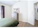Bedroom features hardwood floors, dresser, and a closet at 1167 Rotonda Cir, Rotonda West, FL 33947