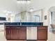 The kitchen has stainless steel appliances, with wooden cabinets and granite counter tops at 1167 Rotonda Cir, Rotonda West, FL 33947