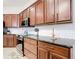 Well-designed kitchen with stainless appliances, tile backsplash, and granite countertops at 1167 Rotonda Cir, Rotonda West, FL 33947