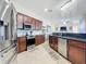 Kitchen with stainless steel appliances, granite countertops, and ample cabinet space at 1167 Rotonda Cir, Rotonda West, FL 33947
