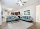 Open-concept living space with modern sofas, kitchen view, and a cozy, inviting atmosphere at 1167 Rotonda Cir, Rotonda West, FL 33947