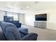 Living room with plush sofa, large-screen TV, and ample space for relaxation and entertainment at 1167 Rotonda Cir, Rotonda West, FL 33947