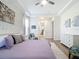 Spacious main bedroom with elegant decor, a cozy seating area, and an ensuite bathroom access at 1167 Rotonda Cir, Rotonda West, FL 33947
