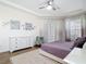 Bright and airy main bedroom featuring a comfortable bed, dresser, and ample natural light at 1167 Rotonda Cir, Rotonda West, FL 33947