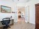Office with french doors and wood-look floors that lead to a living room space at 1167 Rotonda Cir, Rotonda West, FL 33947