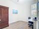 Bright office with a built-in desk, wood floors, and a large window at 1167 Rotonda Cir, Rotonda West, FL 33947