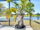 Potted palm tree near the pool with 'no glass allowed' sign at 1167 Rotonda Cir, Rotonda West, FL 33947
