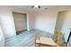 Bright bedroom features closet with shelving and neutral flooring at 11750 Tempest Harbor Loop, Venice, FL 34292