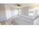Bright bedroom features hardwood floors and two windows with lake view at 11750 Tempest Harbor Loop, Venice, FL 34292