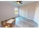 Bedroom features natural lighting, ceiling fan, closet, and furnishings at 11750 Tempest Harbor Loop, Venice, FL 34292