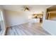 Dining room with view of modern kitchen with stainless steel appliances at 11750 Tempest Harbor Loop, Venice, FL 34292
