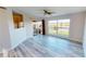 Bright living room with scenic pond views and sliding door access to an outdoor patio at 11750 Tempest Harbor Loop, Venice, FL 34292