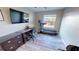 Spacious office features a large desk, a TV mounted on the wall, and a treadmill for exercise at 11750 Tempest Harbor Loop, Venice, FL 34292