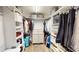 Walk-in closet featuring built-in shelving and plenty of storage space at 11750 Tempest Harbor Loop, Venice, FL 34292