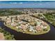 Stunning aerial view of a community surrounded by water, highlighting the unique layout and serene setting at 13100 S Mccall Rd # 112, Port Charlotte, FL 33981