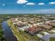Aerial view of homes in a waterfront community showcasing their prime location and access to amenities and highway at 13100 S Mccall Rd # 112, Port Charlotte, FL 33981