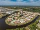 Aerial view of a waterfront community with meticulously landscaped grounds and tranquil ponds at 13100 S Mccall Rd # 112, Port Charlotte, FL 33981