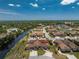 A scenic aerial view of the waterfront community featuring lush landscaping and easy access to local amenities and roads at 13100 S Mccall Rd # 112, Port Charlotte, FL 33981