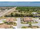 Aerial view of waterfront homes surrounded by lush greenery, offering tranquil living with highway access nearby at 13100 S Mccall Rd # 112, Port Charlotte, FL 33981