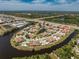 A birdseye view of community near shopping and highways, nestled in a private waterfront setting with lush landscaping at 13100 S Mccall Rd # 112, Port Charlotte, FL 33981