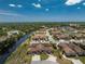 Aerial view showcases the beautiful community, landscaping and nearby creek at 13100 S Mccall Rd # 112, Port Charlotte, FL 33981