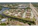 Panoramic aerial view of a tranquil waterfront community with lush landscaping and community ponds at 13100 S Mccall Rd # 112, Port Charlotte, FL 33981