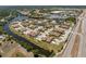 Aerial view of a waterfront community with well-maintained homes and lush landscaping at 13100 S Mccall Rd # 112, Port Charlotte, FL 33981