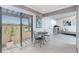 Welcoming dining area, featuring a modern table set and sliding glass doors for abundant natural light at 13100 S Mccall Rd # 112, Port Charlotte, FL 33981