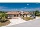 Charming single story home featuring a well-manicured lawn, cozy courtyard and private driveway at 13100 S Mccall Rd # 112, Port Charlotte, FL 33981