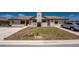Charming home exterior with a well-kept lawn and stucco facade, featuring a covered entryway and pergola at 13100 S Mccall Rd # 112, Port Charlotte, FL 33981