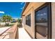 Charming home exterior with stucco walls, dark trimmed windows and a beautiful palm tree view at 13100 S Mccall Rd # 112, Port Charlotte, FL 33981