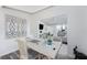 Inviting home office with a view into the living area with stylish decor and natural light at 13100 S Mccall Rd # 112, Port Charlotte, FL 33981
