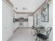Bright kitchen featuring ample white cabinetry and a view to the outside at 13100 S Mccall Rd # 112, Port Charlotte, FL 33981