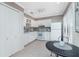 Bright kitchen featuring ample white cabinetry and a dining table at 13100 S Mccall Rd # 112, Port Charlotte, FL 33981