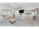 A cozy living room featuring an open layout, contemporary furniture and views into the adjacent kitchen at 13100 S Mccall Rd # 112, Port Charlotte, FL 33981