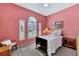 Cozy bedroom featuring natural light from plantation shutters and stylish furniture at 13335 Golf Pointe Dr, Port Charlotte, FL 33953
