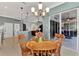 Inviting dining area leading to an outdoor patio through sliding glass doors, with open concept design at 13335 Golf Pointe Dr, Port Charlotte, FL 33953
