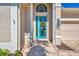Close up of a beautiful entryway featuring a decorative blue front door with glass panels and a stone pathway at 13335 Golf Pointe Dr, Port Charlotte, FL 33953
