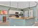 Beautiful kitchen featuring a breakfast bar, granite countertops, stainless steel appliances, and modern pendant lighting at 13335 Golf Pointe Dr, Port Charlotte, FL 33953