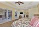 Bright main bedroom with seating area and ensuite bathroom offering comfort and style at 13335 Golf Pointe Dr, Port Charlotte, FL 33953