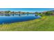 Picturesque pond view offering a tranquil backdrop to the homes in this desirable neighborhood at 13335 Golf Pointe Dr, Port Charlotte, FL 33953