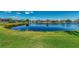 Scenic pond view offering a tranquil backdrop to the homes in this peaceful community at 13335 Golf Pointe Dr, Port Charlotte, FL 33953
