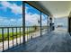 Enjoy stunning waterfront views from this spacious screened balcony with beautiful wood-look floors at 1400 Beach Rd # 2, Englewood, FL 34223