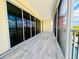 Long screened in lanai with storm shutters and water views at 1400 Beach Rd # 2, Englewood, FL 34223