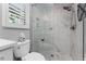 Updated bathroom showing a walk-in glass shower at 1400 Beach Rd # 2, Englewood, FL 34223