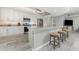 Open kitchen featuring granite counters, stainless appliances and a bar with seating at 1400 Beach Rd # 2, Englewood, FL 34223