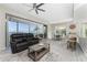 Cozy seating area with an open floor plan and panoramic water views from the adjacent patio at 1400 Beach Rd # 2, Englewood, FL 34223