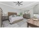 Serene main bedroom featuring a neutral color palette and a large window with natural light at 1400 Beach Rd # 2, Englewood, FL 34223