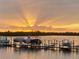 Capture the breathtaking sunset over the water and boats docked in the harbor at 1400 Beach Rd # 2, Englewood, FL 34223